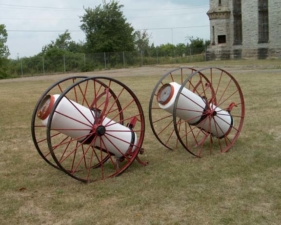 Some old chemical fire extinguishers on the front lawn.