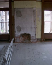 The remains of a fireplace in one of the rooms.