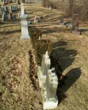 A row of tombstones for children and infants.