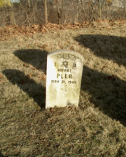 The small tombstone for Infant Pler, who died on May 21, 1949.