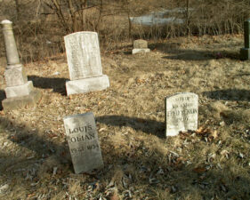 The tombstones for 10-year-old Louis Olian and infant son of Fred Yenkin. The infant son lived for only 7 hours and 51 minutes.