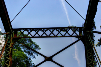 Looking up at the latticework at the top of Orange Road Bridge.