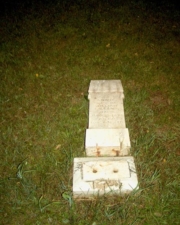 The tombstone for Annie Gilland had been knocked over. She died on June 8, 1873. The stone has since been repaired.