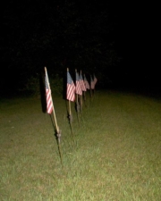 A row of veterans flags was next to the road. Perhaps they were for lost graves of veterans.