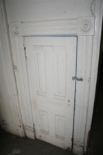 A small storage space underneath the stairway.