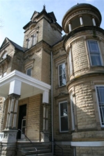 The side entrance just behind the main turret of the castle.