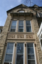 Large windows just behind the side entry. Notice the detailed masonry.