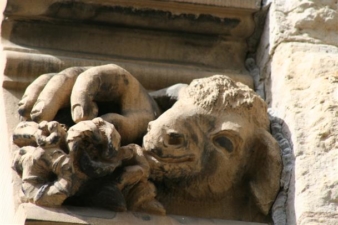 On a different window was the carving of a hand, flowers and lamb.