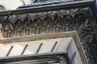 More detailed stonework along the roofline of the castle.