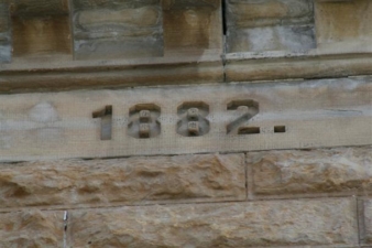 1882, the year the Mast Castle was completed, engraved high above.