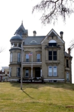The sign on the front lawn of the mansion defined it as Castle Knoll.