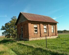 The windows of the school were boarded over.