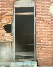 You can see the interior of the school through the doorway.