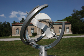 A closer look at the instrument atop the ornate base.