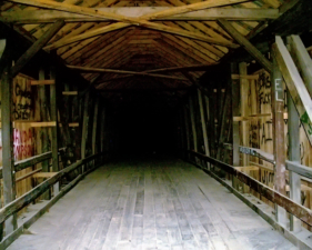 You can see the bridge's slight hump in the roadway.