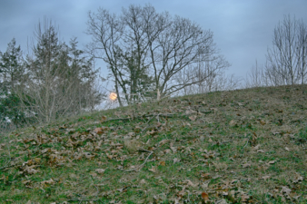 The moon rose over the mound.
