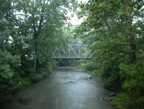 A newer, but still old, steel bridge as seen from the left window.