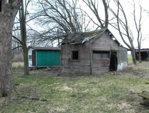 A couple of old shacks. Perhaps it served as a summer kitchen or storage building.