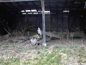 Another outbuilding had an open-faced shed.