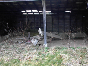 Another outbuilding had an open-faced shed.