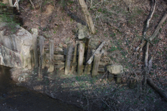 Wooden posts and beams assisted in holding up the hillside.