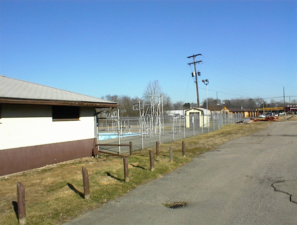 You can see the high dive platform between the clubhouse and storage shed.