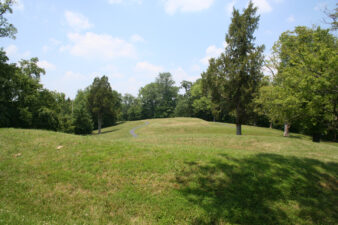 The mound snaked its way toward the edge of the plateau.