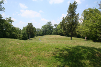 The mound snaked its way toward the edge of the plateau.