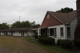The Mathews family lived in the house to the right. The motel was built just east of the home.