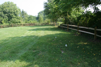 The far corner of the cemetery.