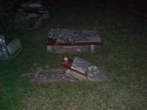 This table had been knocked over and the tombstone rested on the ground.