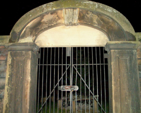 The cemetery's gate on a return trip in September 2003.