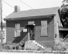 An old photo of the land office at its original location on Gay Street.