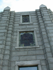A closer look at the stained glass windows on the front of the building.