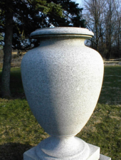 Large solid granite urns sat on either side of the crematory stairway.