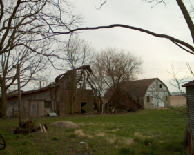 The outbuildings to the rear of the brick house.