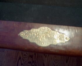 The Bott Brothers plaque on the billiard table.