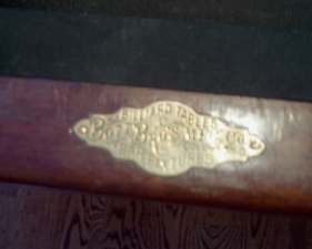 The Bott Brothers plaque on the billiard table.