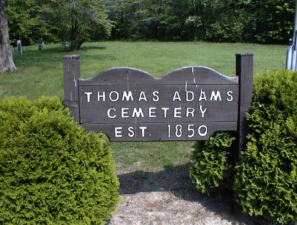 The sign in the middle of Thomas Adams Cemetery indicated it was established in 1850.