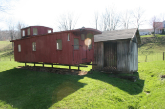 Caboose 33 and a flag station for the railway that once ran next to the well.