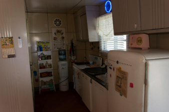 The kitchen was restored to how it could have looked in the 1950s, minus the water cooler.