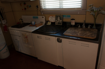 The home's stove, Thor washing machine/dishwasher, and sink.