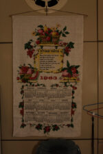 A 1963 calendar hung on the kitchen wall.