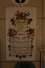 A 1963 calendar hung on the kitchen wall.