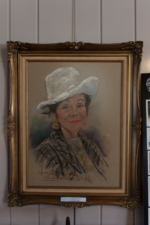 A portrait of Helen Conti, aka Ilonka, hung above the piano.