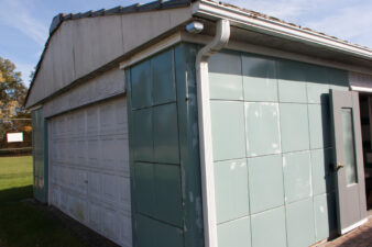 A somewhat rare Lustron garage was next to the society's headquarters.