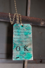 An original plumbing inspection tag inside the utility area's wall.