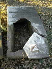 A closer look at Isaac Williams' broken tomb. Isaac died on February 15, 1848.