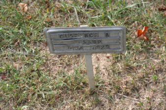 A small metal marker served as the memorial for Clarence Jessup. Clarence was born in 1862 and died in 1929.
