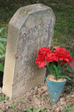 The hand carved stone for Raymon Fletcher, who died at eight months and twenty days on December 22, 1928.